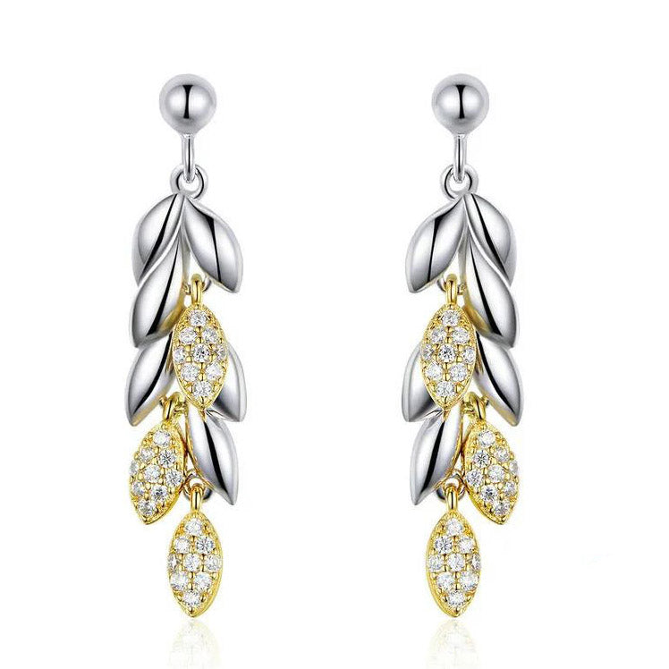 silver and gold earrings leaf drop