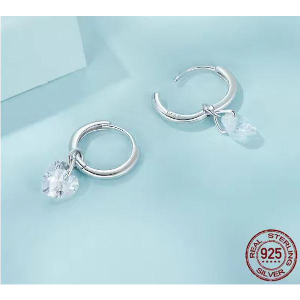silver hoop earrings cubic zirconia close up view
