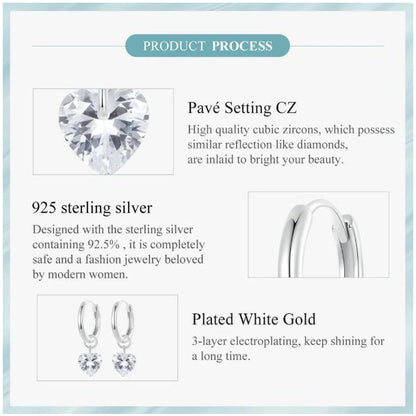 silver hoop earrings heart shape elegant styling
